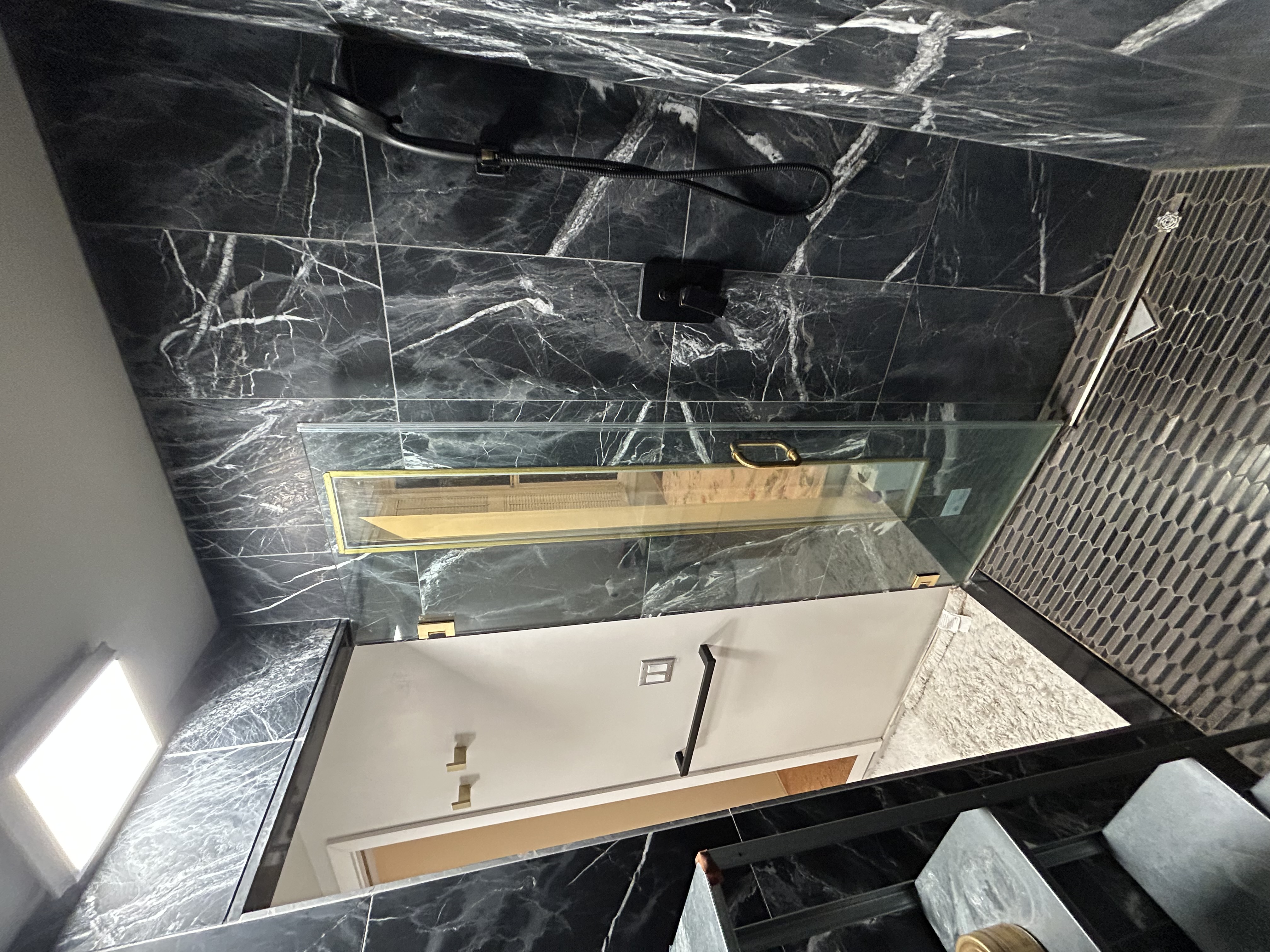 Walk-in shower with frameless glass